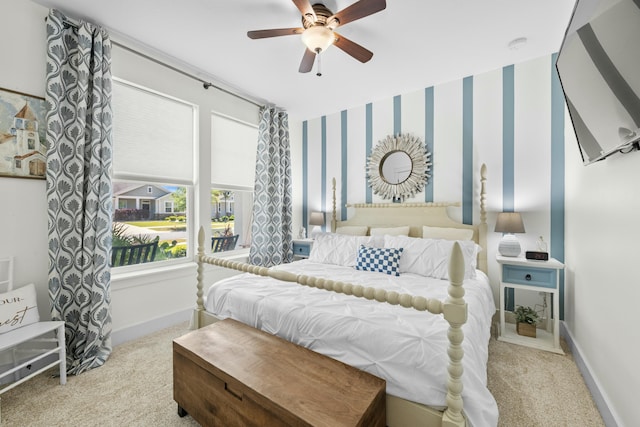 bedroom featuring carpet floors, baseboards, and ceiling fan