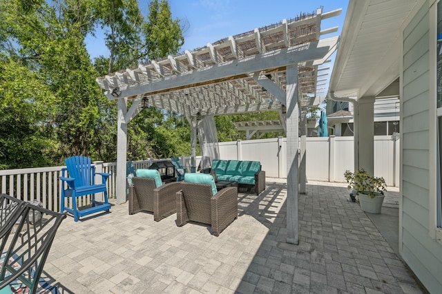 view of patio / terrace featuring a pergola, a fenced backyard, and an outdoor living space
