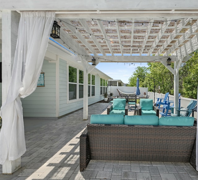 view of patio featuring a pergola, an outdoor living space, and fence