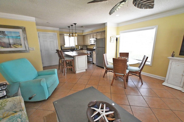 dining space featuring light tile patterned floors, baseboards, ornamental molding, and a textured ceiling