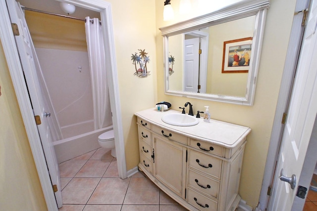 bathroom with tile patterned floors, shower / bath combo, toilet, and vanity