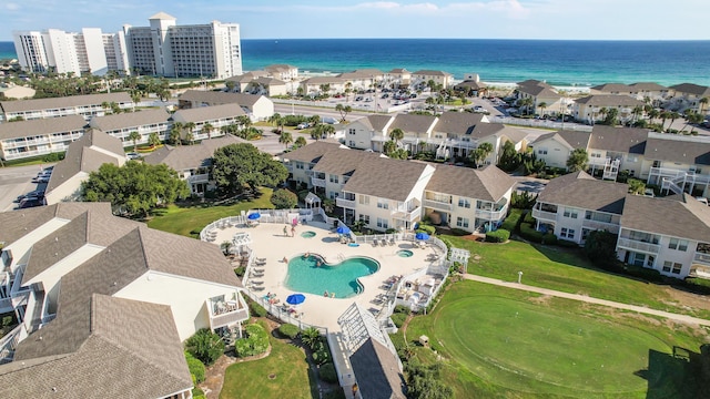 birds eye view of property with a water view