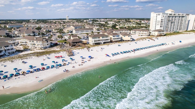 aerial view with a water view and a view of the beach
