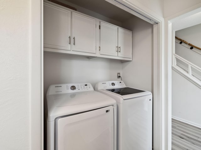 356 Billfish Ave Unit 4, Fort Walton Beach, FL 32548 - laundry area featuring separate washer and dryer, light wood finished floors, and cabinet space
