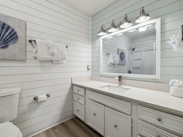 356 Billfish Ave Unit 4, Fort Walton Beach, FL 32548 - full bathroom with wood walls, toilet, wood finished floors, and walk in shower
