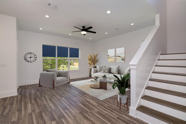living room featuring wood finished floors, visible vents, recessed lighting, and stairs