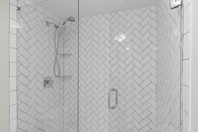 bathroom featuring a shower stall