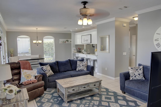 38 Aquamarine Cv, Miramar Beach, FL 32550 - living room with ceiling fan with notable chandelier, light tile patterned flooring, baseboards, ornamental molding, and visible vents