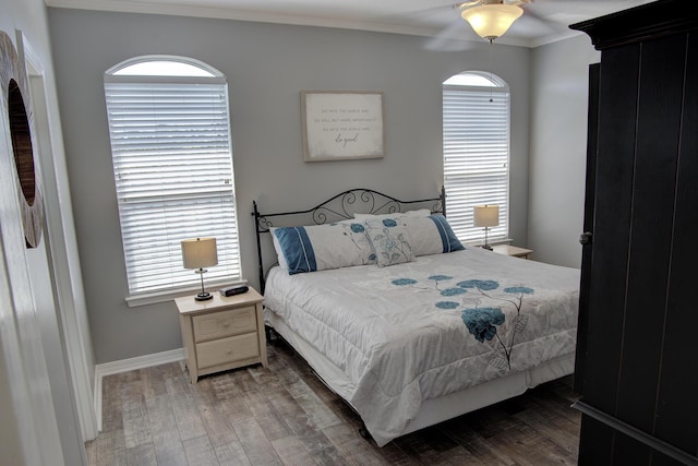 38 Aquamarine Cv, Miramar Beach, FL 32550 - bedroom featuring multiple windows, baseboards, crown molding, and wood finished floors