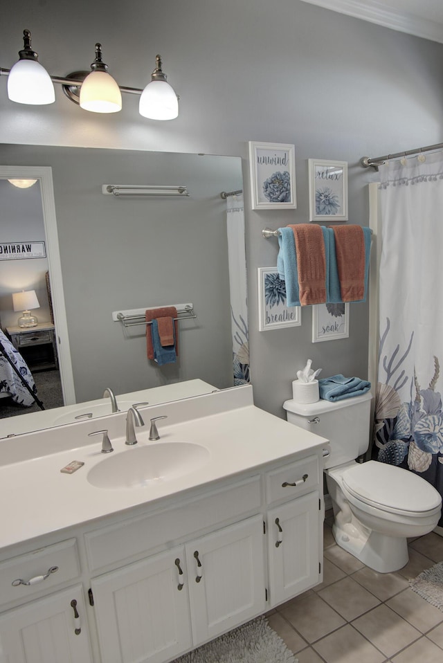 38 Aquamarine Cv, Miramar Beach, FL 32550 - ensuite bathroom featuring tile patterned floors, ensuite bath, vanity, and toilet