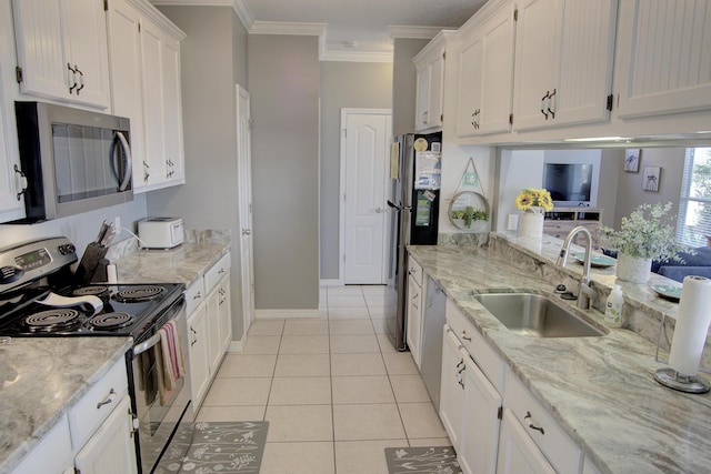 38 Aquamarine Cv, Miramar Beach, FL 32550 - kitchen featuring ornamental molding, a sink, light tile patterned flooring, appliances with stainless steel finishes, and white cabinetry