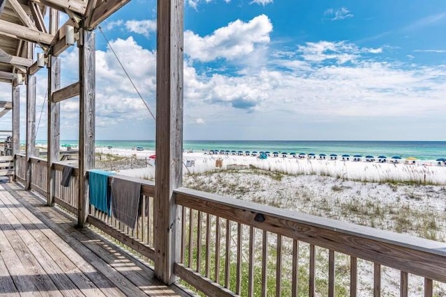 38 Aquamarine Cv, Miramar Beach, FL 32550 - wooden deck featuring a beach view and a water view