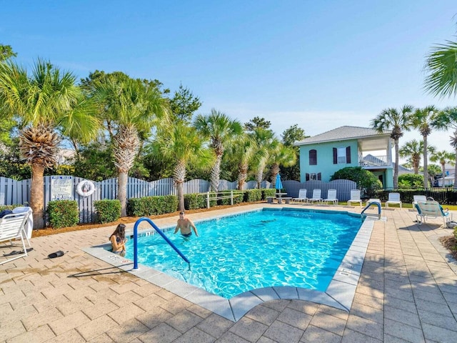 38 Aquamarine Cv, Miramar Beach, FL 32550 - community pool with fence and a patio