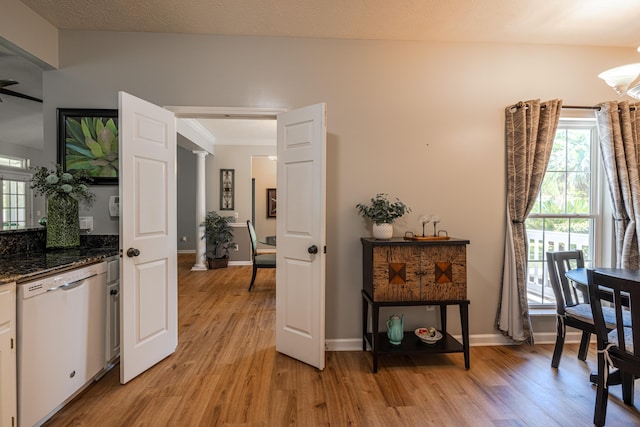 dining room with light wood-style flooring and baseboards