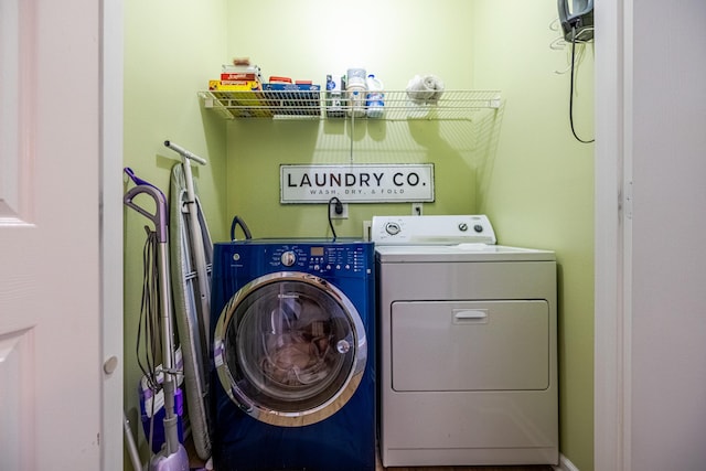 laundry room with separate washer and dryer and laundry area