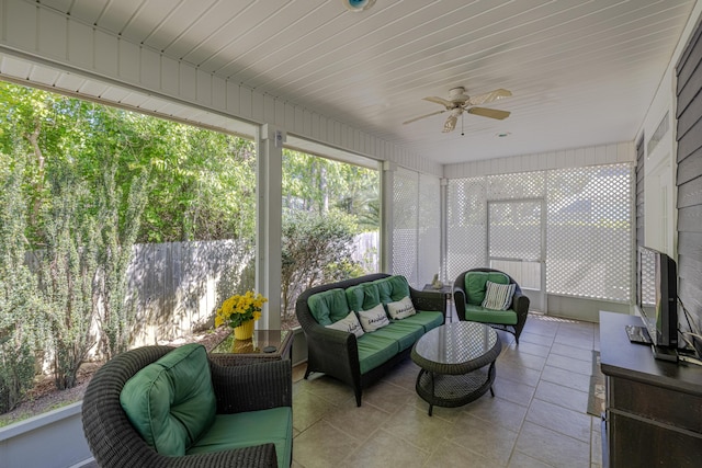 sunroom featuring ceiling fan and outdoor lounge area