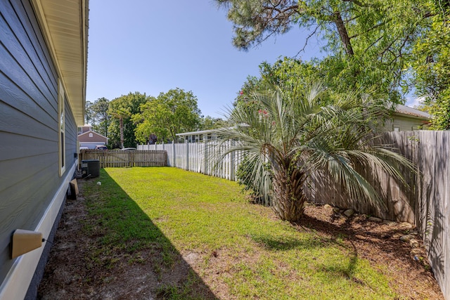 view of yard featuring a fenced backyard and central AC unit
