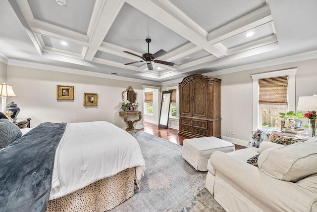 bedroom featuring coffered ceiling, crown molding, wood finished floors, and beam ceiling