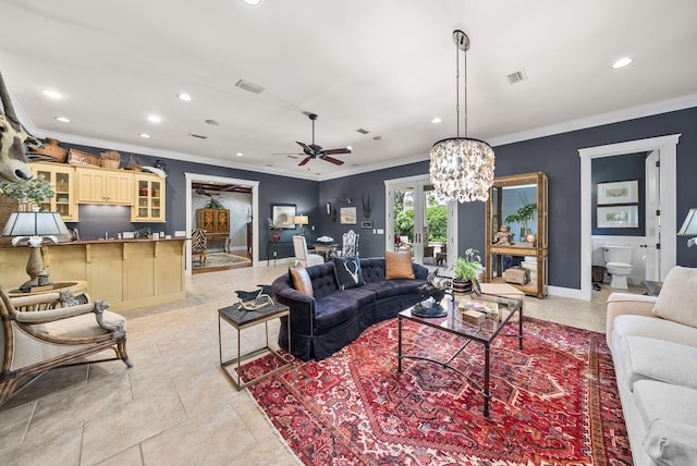 living room featuring recessed lighting, visible vents, crown molding, and french doors