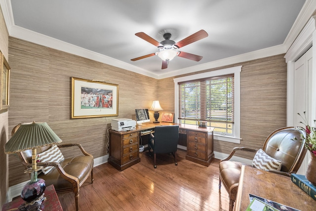 office with wallpapered walls, wood finished floors, ornamental molding, baseboards, and ceiling fan