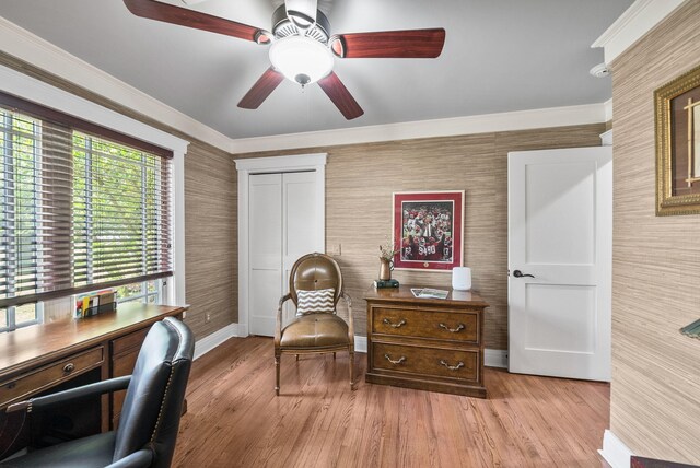 office space with light wood-type flooring, wallpapered walls, baseboards, and ceiling fan