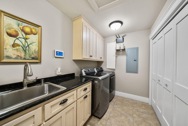 washroom with washer and clothes dryer, a sink, electric panel, baseboards, and cabinet space