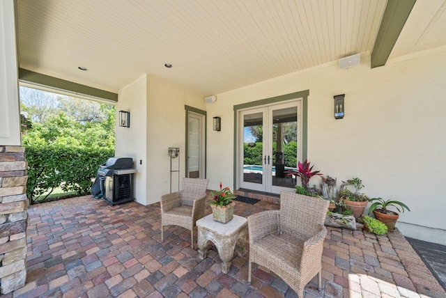 view of patio / terrace featuring a grill and french doors