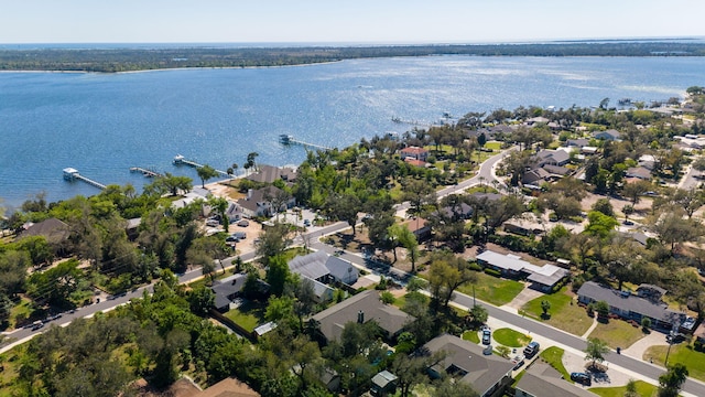 birds eye view of property featuring a water view and a residential view