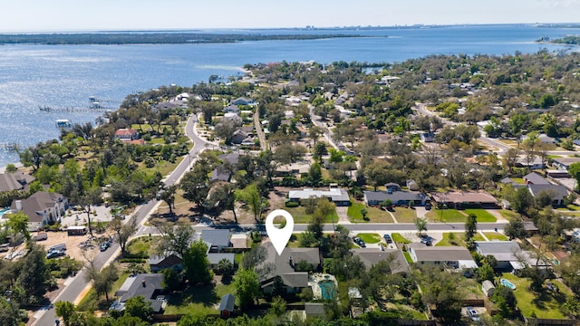 drone / aerial view featuring a water view and a residential view