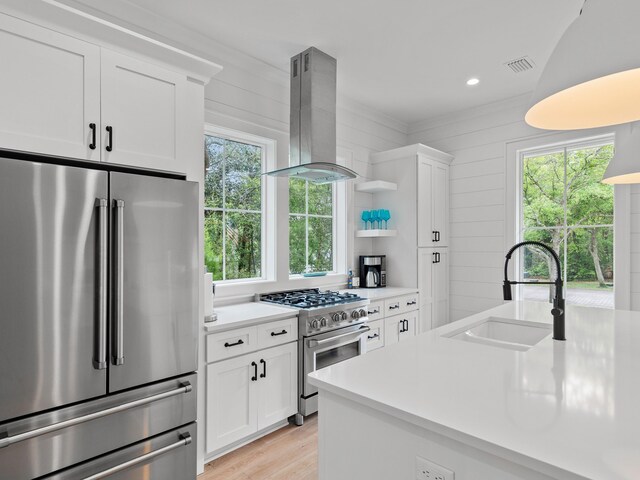 105 Greenbriar Ln, Santa Rosa Beach, FL 32459 - kitchen featuring a sink, high end appliances, light countertops, and island exhaust hood