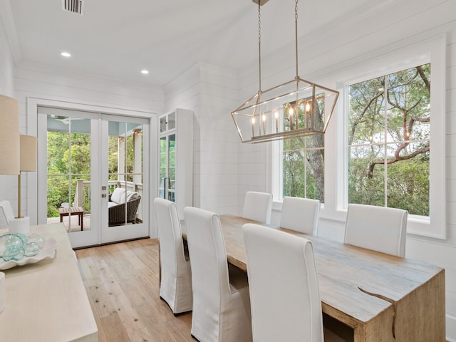 105 Greenbriar Ln, Santa Rosa Beach, FL 32459 - dining area featuring a chandelier, a wealth of natural light, french doors, and light wood-type flooring