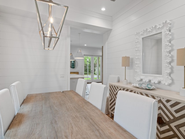 105 Greenbriar Ln, Santa Rosa Beach, FL 32459 - hallway with a notable chandelier, wooden walls, and french doors