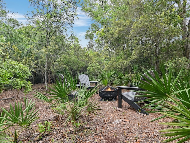 105 Greenbriar Ln, Santa Rosa Beach, FL 32459 - view of yard with a fire pit