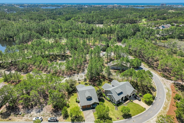 aerial view featuring a wooded view