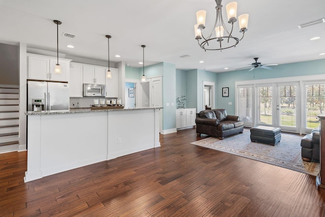 living room featuring recessed lighting, visible vents, dark wood-style floors, and ceiling fan with notable chandelier