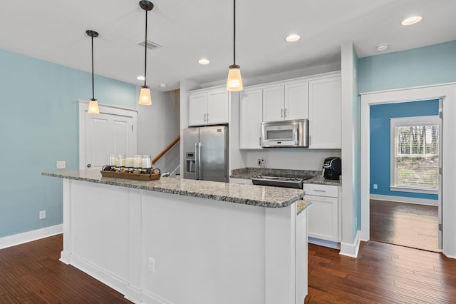 kitchen featuring baseboards, visible vents, appliances with stainless steel finishes, and dark wood-style floors