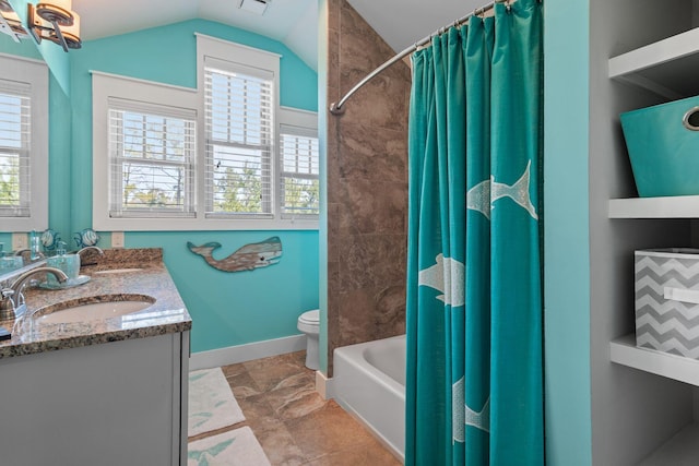 bathroom with a sink, double vanity, toilet, vaulted ceiling, and shower / bath combo with shower curtain