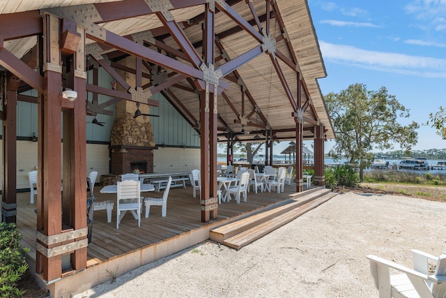 dock area featuring outdoor dining area and a wooden deck