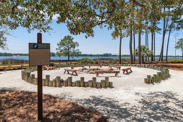 surrounding community with a water view