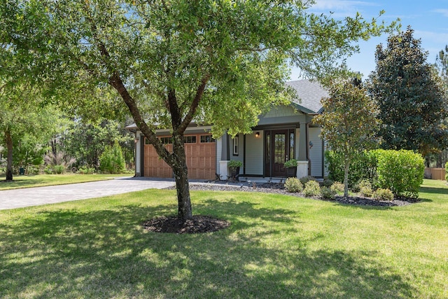 view of property hidden behind natural elements with a garage, driveway, a front lawn, and covered porch