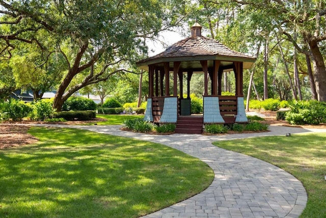 surrounding community with a gazebo and a lawn