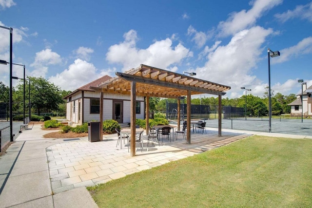 exterior space featuring a pergola, a tennis court, and fence