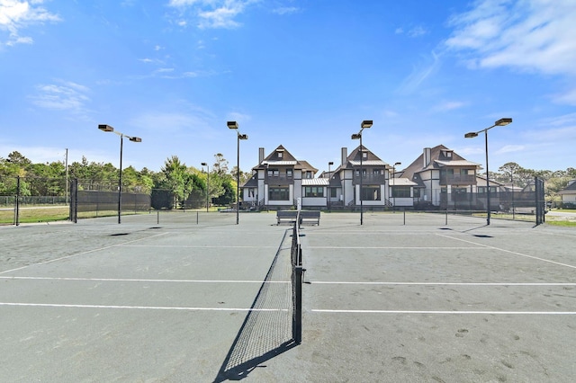 view of tennis court with fence