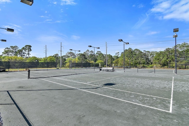 view of sport court with fence