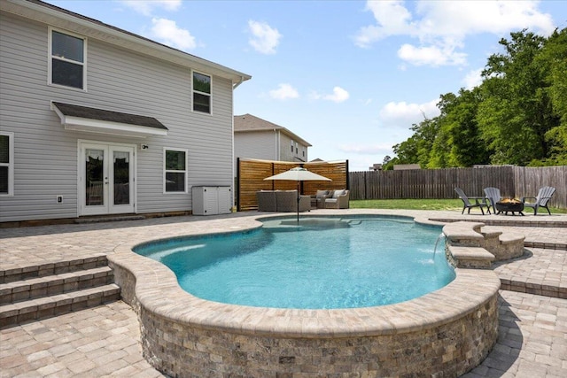 3129 Partridge Dr, Crestview, FL 32539 - view of swimming pool featuring a fire pit, a patio area, french doors, and a fenced backyard