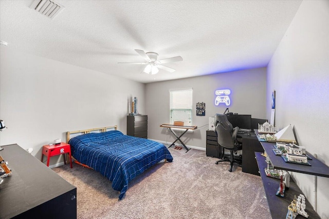 3129 Partridge Dr, Crestview, FL 32539 - carpeted bedroom with an office area, a ceiling fan, and a textured ceiling