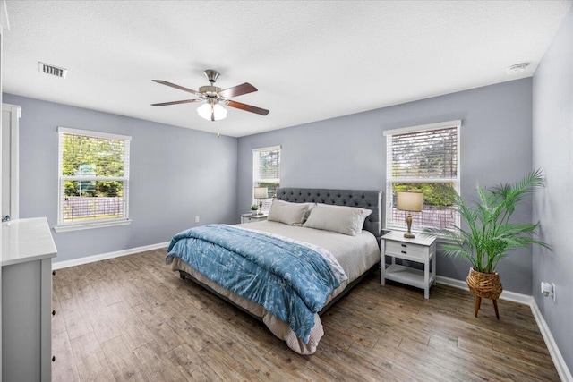 3129 Partridge Dr, Crestview, FL 32539 - bedroom featuring wood finished floors, baseboards, and ceiling fan