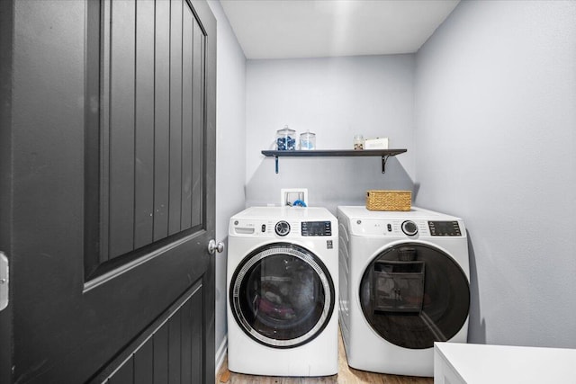 3129 Partridge Dr, Crestview, FL 32539 - washroom featuring separate washer and dryer and light wood-type flooring