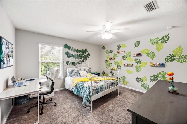3129 Partridge Dr, Crestview, FL 32539 - carpeted bedroom featuring a desk, a ceiling fan, baseboards, and a textured ceiling