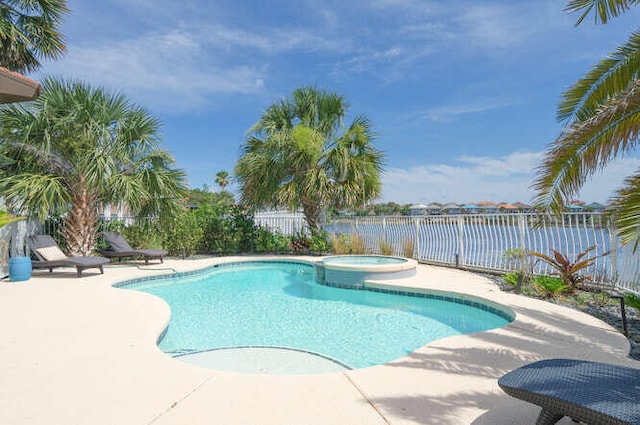 4720 Rendezvous Cv, Destin, FL 32541 - view of pool with a fenced backyard, a patio, a water view, and a pool with connected hot tub
